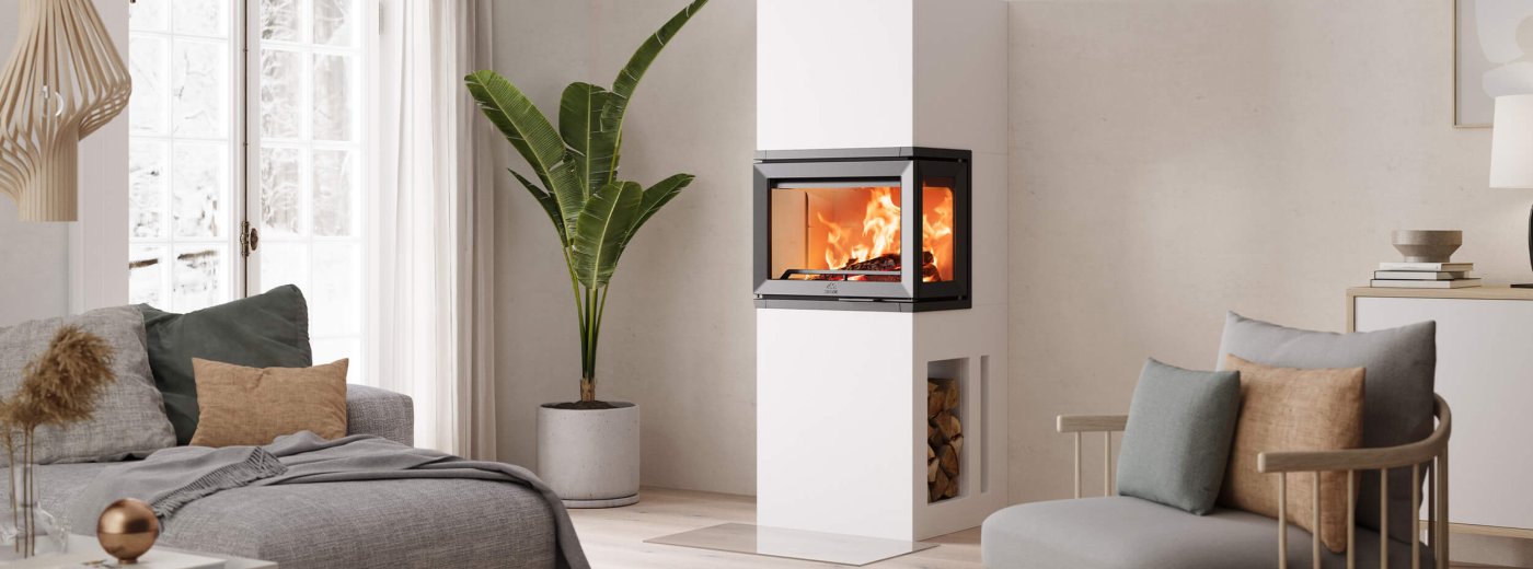 Jøtul FS 520 FRL white fireplace in a bright modern Scandinavian living room 